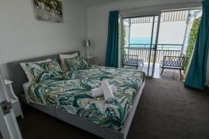 Ένα ή περισσότερα κρεβάτια σε δωμάτιο στο Moreton Island Villas and Apartments +43 φωτογραφίες