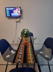 TV a/nebo společenská místnost v ubytování Residencial Gicamar