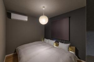 Ένα ή περισσότερα κρεβάτια σε δωμάτιο στο tonaResort Furano