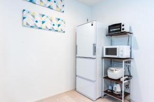 Kuchyň nebo kuchyňský kout v ubytování Grandioso Onna 7-D - Vacation STAY 86760v