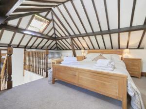 a bedroom with a bed with white towels on it at 1 Bed in Eskdale SZ471 in Beckfoot