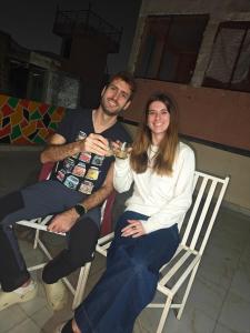 a man and a woman sitting in chairs at The Pink Nest - Backpackers Abode in Jaipur