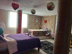 Postel nebo postele na pokoji v ubytování Hospedaje la Cascada + 7 fotografií