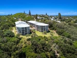 an aerial view of a building on a hill at Whalewatch Ocean Beach Resort in Point Lookout