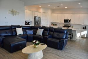 a living room with a couch and a table at BnB Vacation Home in Queen Creek