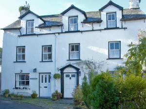 a white house with a white door at 3 Bed in Hawkshead Village LLH39 in Hawkshead