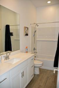 a bathroom with a sink and a toilet and a shower at BnB Vacation Home in Queen Creek +28 photos