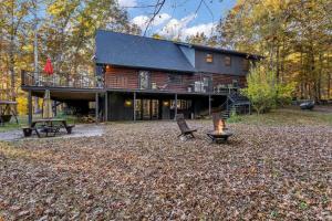 a log home with a fire pit in the yard at Secluded Lakeview Retreat 10 Mins to Leipers Fork in Kingfield +34 photos