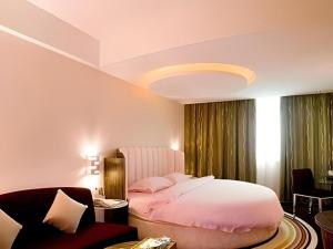 Giường trong phòng chung tại Orient Sunseed Hotel Airport Branch