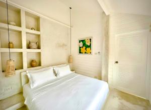 Postel nebo postele na pokoji v ubytování Bella & Palma & Casablanca Villas