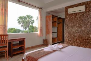 Postel nebo postele na pokoji v ubytování Kep Arunrass Boutique