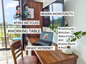 a room with a desk with a laptop on it at EasyLife Villa Hội An in Tân Thành (1)