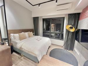 Ένα ή περισσότερα κρεβάτια σε δωμάτιο στο Agile Residence Bukit Bintang by Skyline Homes +60 φωτογραφίες