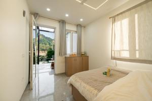 Ένα ή περισσότερα κρεβάτια σε δωμάτιο στο PUNTUSH By The StayCationer +28 φωτογραφίες