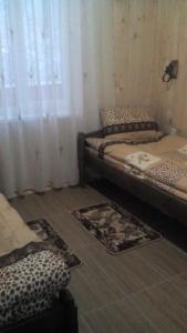 Postel nebo postele na pokoji v ubytování Санаторий "Синяк" гостиный двор "ПРОЛИСОК"
