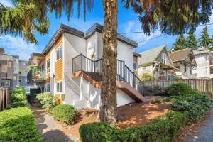 a house with a tree in front of it at Brand New 2BR Queen Anne Condo Designer's Taste in Seattle +41 photos