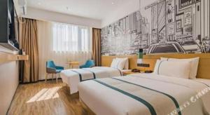 Ένα ή περισσότερα κρεβάτια σε δωμάτιο στο City Comfort Inn Guiyang Airport Future Ark +54 φωτογραφίες