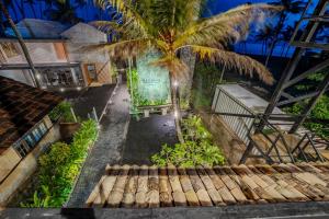 an overhead view of a house with a palm tree at Secret Beach Ahangama in Ahangama
