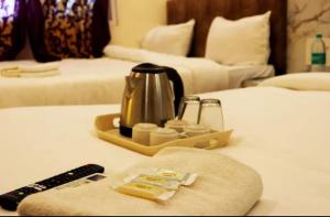 Ένα ή περισσότερα κρεβάτια σε δωμάτιο στο hotel saffron +15 φωτογραφίες