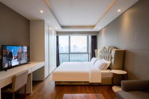 TV a/nebo společenská místnost v ubytování Estee ApartHotel