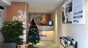 a christmas tree in the corner of a store at Shell Hotel Shanghai Normal University Hongcao Road Metro Station Guiping Road in Shanghai