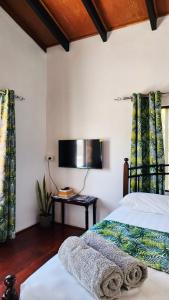 TV a/nebo společenská místnost v ubytování sunny's homestay