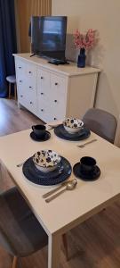 Μια τηλεόραση ή/και κέντρο ψυχαγωγίας στο Apartament Blue