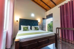 a bedroom with a large bed with a large window at Sea Bloom Villa in Kamburugamuwa +106 photos