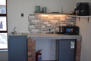 Η κουζίνα ή μικρή κουζίνα στο The Crest Studio