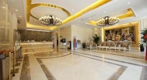 a lobby of a hotel with two chandeliers at Vienna Hotel Nanjing Zhongshan Mausoleum in Qilinmen