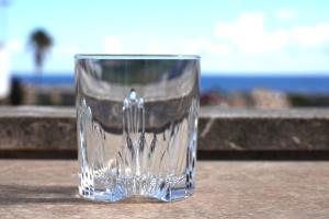 a glass cup sitting on top of a table at Guardamar Sea View Villa in Guardamar del Segura