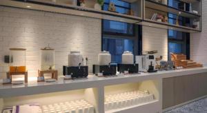 a store with a counter with white appliances on it at Echarm Hotel Wuhan Gaotie Jianshe 2nd Road Metro Exit in Wuhan