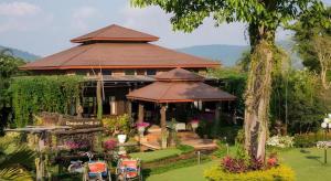 a large house with a pavilion in a garden at De Bua Valley in Ban Kom