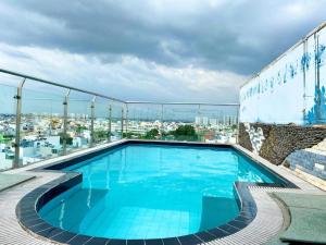 a swimming pool on the roof of a building at Ha Oanh Hotel in Ho Chi Minh City