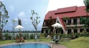 a resort with a swimming pool in front of a building at Daosavanh Resort & Spa Hotel in Savannakhet