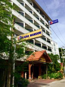 a building with a sign that reads acaba mansion at Arcadia Mansion in Pattaya