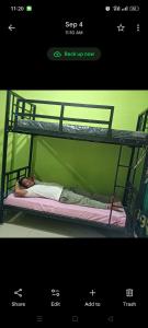 Ένα ή περισσότερα κρεβάτια σε δωμάτιο στο BACKPACKER LODGE Trekking & Transport