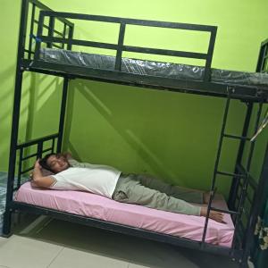 Ένα ή περισσότερα κρεβάτια σε δωμάτιο στο BACKPACKER LODGE Trekking & Transport