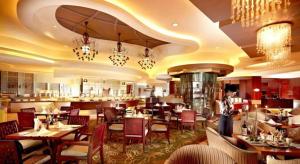 Un restaurante u otro lugar para comer en New Century Grand Hotel Xuzhou