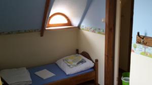 Postel nebo postele na pokoji v ubytování Zagroda Pod Gontem
