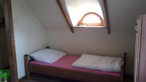 Postel nebo postele na pokoji v ubytování Zagroda Pod Gontem
