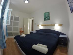 Кровать или кровати в номере Apartment Lara Pisak