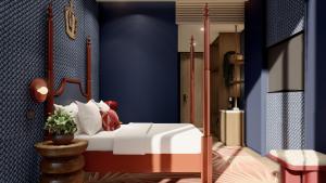 um quarto com uma cama e uma parede azul em Kaban Hotel & Casino Boracay em Boracay