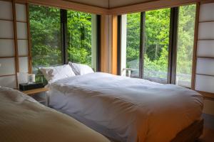 Voodi või voodid majutusasutuse Villa Tombo Hakone toas