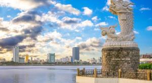 a statue of a dragon on the side of a body of water at Bong Mai Motel in Da Nang +57 photos