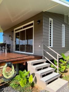 a house with a porch and a wooden deck at Fare Araea in HUH