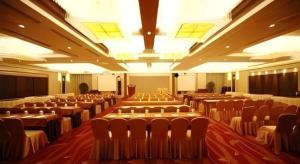 a large room with rows of chairs in it at Ramada Plaza by Wyndham Yangzhou Casa in Yangzhou