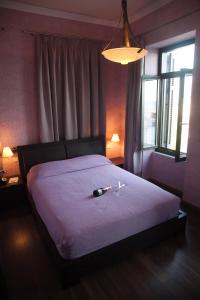 Un pat sau paturi într-o cameră la Spon Boutique Hotel