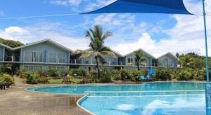 a view of a resort with a swimming pool at Blue West Villas in Votua