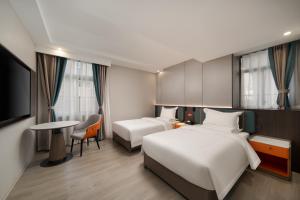 Ένα ή περισσότερα κρεβάτια σε δωμάτιο στο Unitour Hotel Chongqing Jiefangbei Pedestrian Street +53 φωτογραφίες